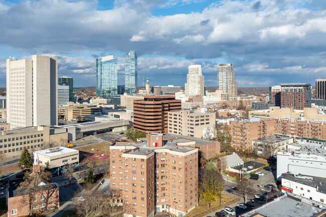 City of White Plains skyline and EV charging infrastructure